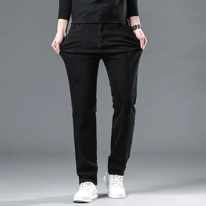 2024 New Winter Pure Black Fleece Thick Warm Jeans Men's loose Straight Elastic Denim Pants classics Casual Plush Trousers